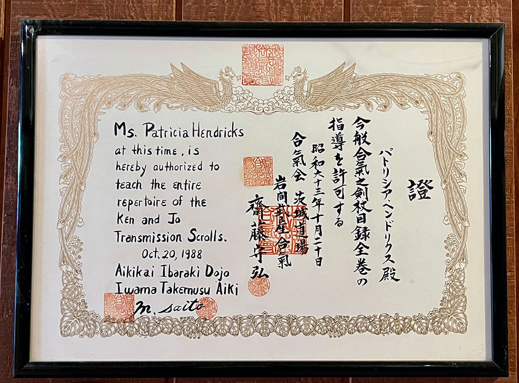 Certficate stating that Patricia Hendricks is granted the permission to teach the complete catalog of Aiki sword and staff. Signed by Saito Morhiro on Ocober 20, 1988.